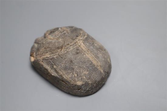 An ancient Egyptian pottery scarab beetle, with hieroglyphic inscriptions length 7.5cm